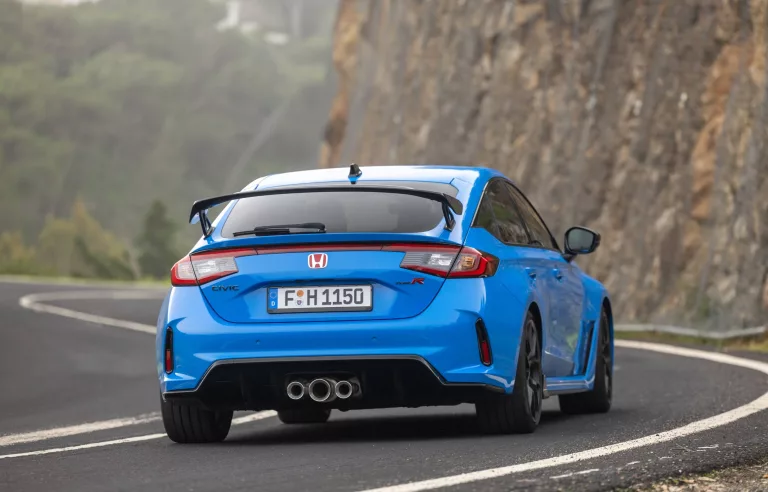 Big wing and triple tailpipes let you know the Civic's intent. 